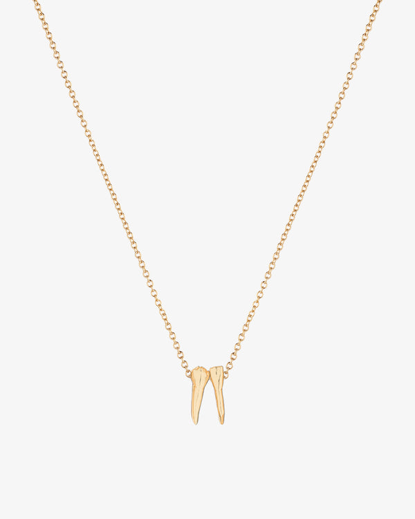 Gold necklace with tooth charm pendants spelling out graduation year 2025