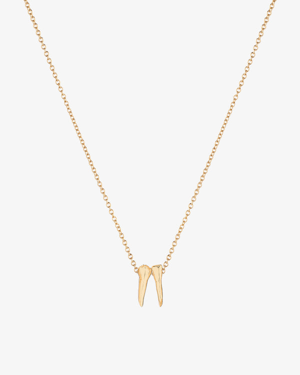 Gold necklace with tooth charm pendants spelling out graduation year 2026