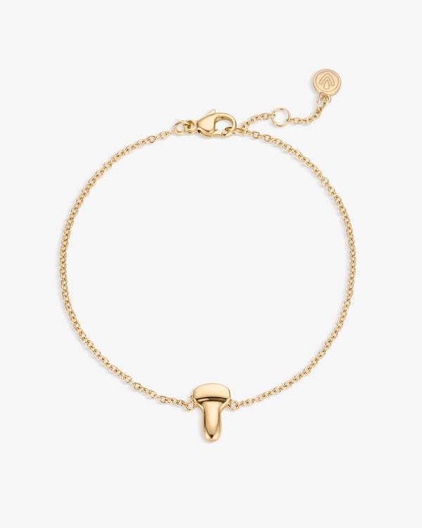 Gold bracelet with an ultrasound probe pendant on a white background
