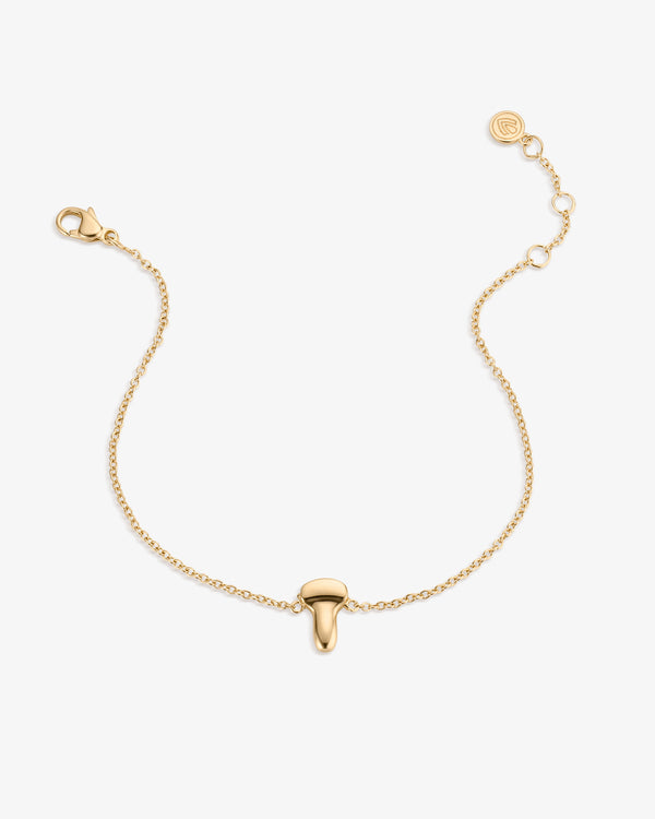 Gold bracelet with an ultrasound probe pendant on a white background