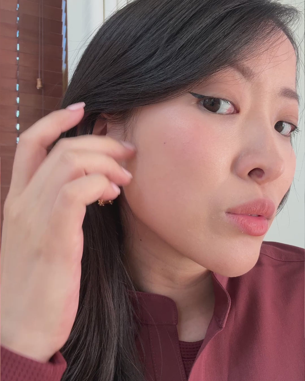 Video modeling gold hoop earrings that feature orthodontic braces brackets